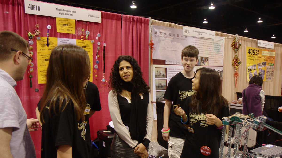 Miral Kotb, founder of iLuminate, talks to Middle School VEX team 4061A, The A-Team, from Manassas Park, Virginia at the 2012 VEX Robotics Competition World Championship.