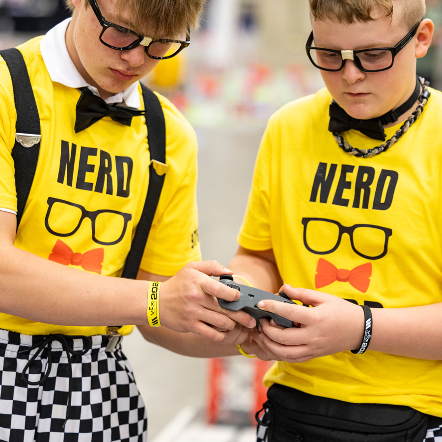 Drivers swap controllers during a VEX IQ Robotics Competition match at VEX Robotics World Championship