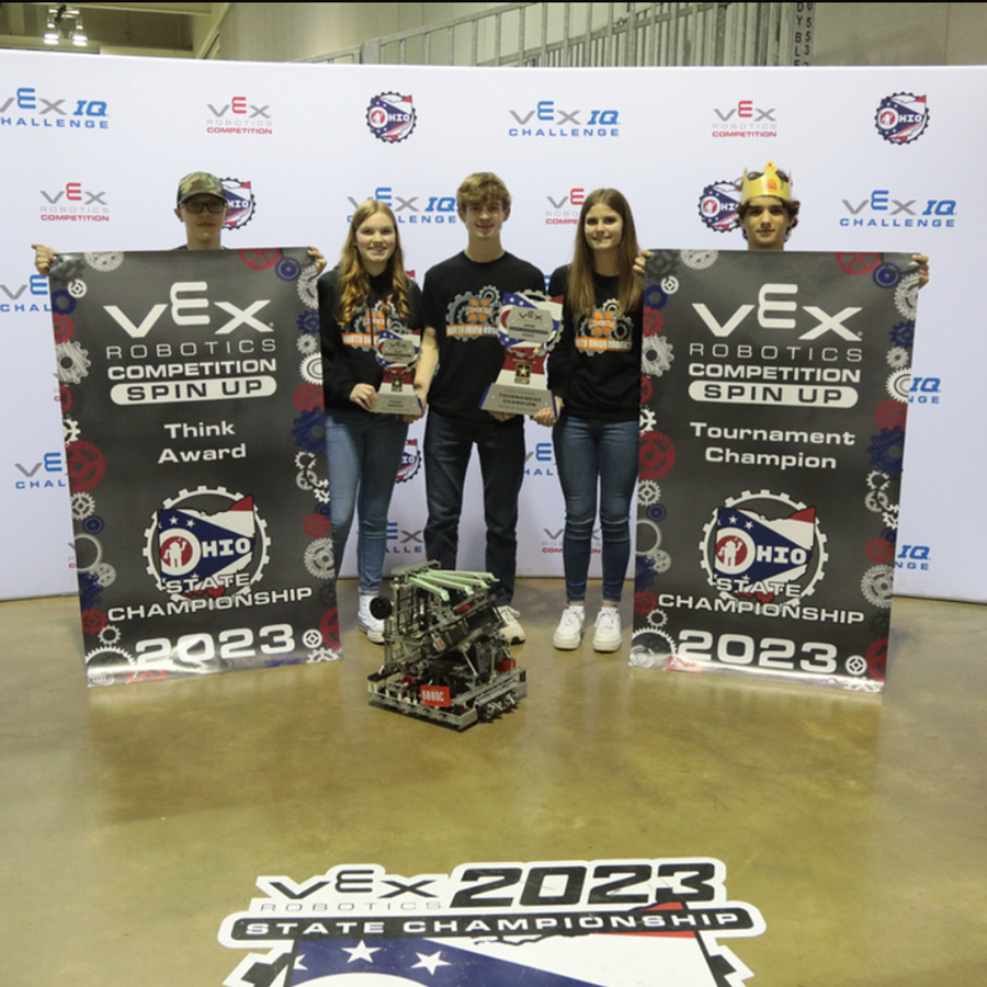 Team holds tournament champions banners