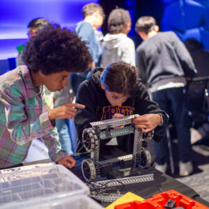 Teams works on a robot