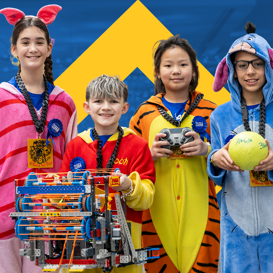 Team wearing costumes poses with robot