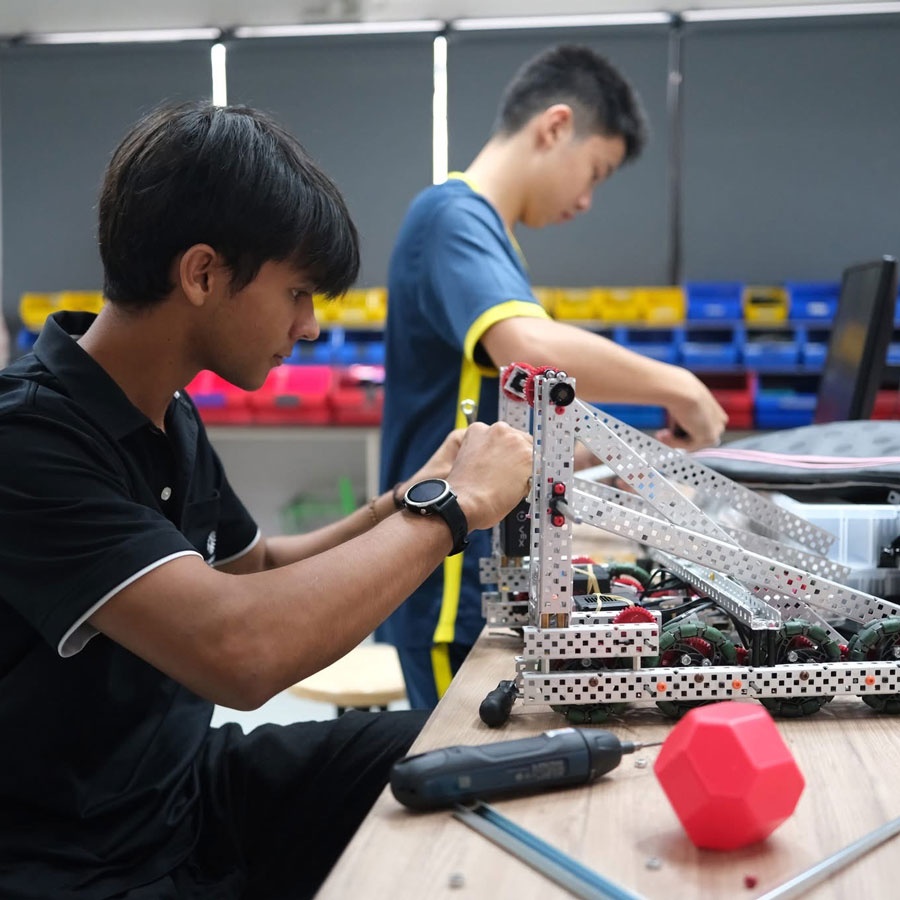 St. Andrews robotics participant works on robot