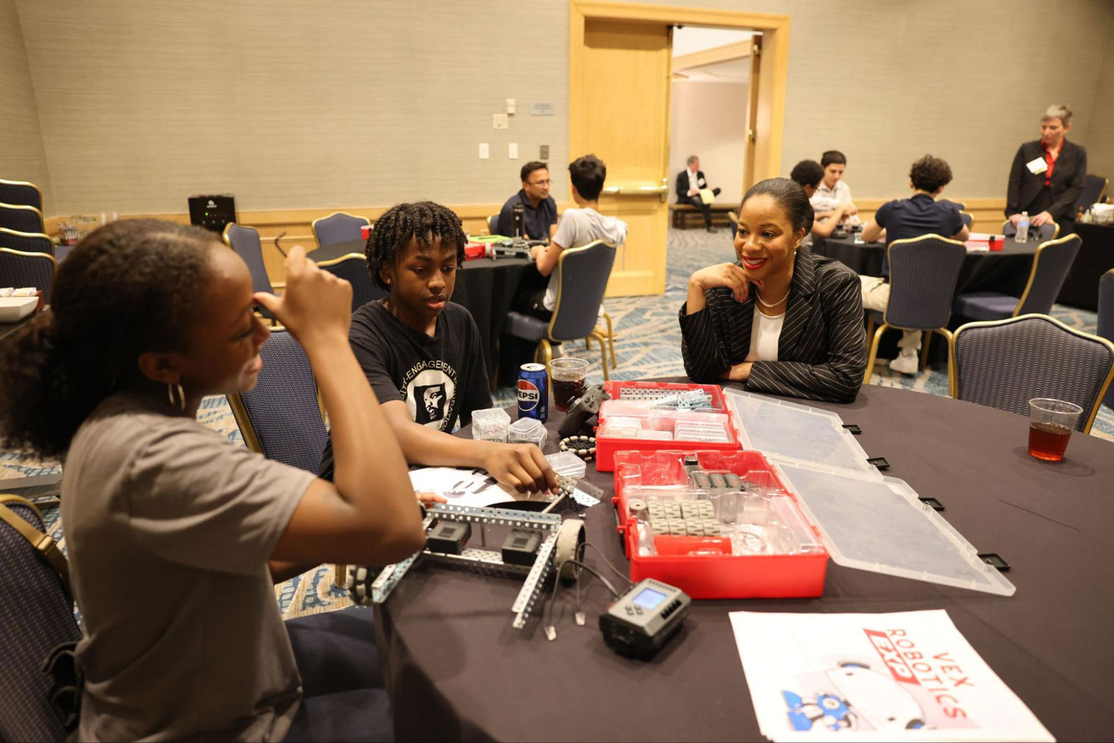 Chandra Donelson works with students on their robots