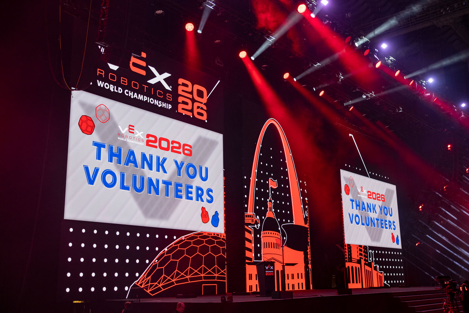 Screen on stage at VEX Robotics World Championship reads "Thank You Volunteers"