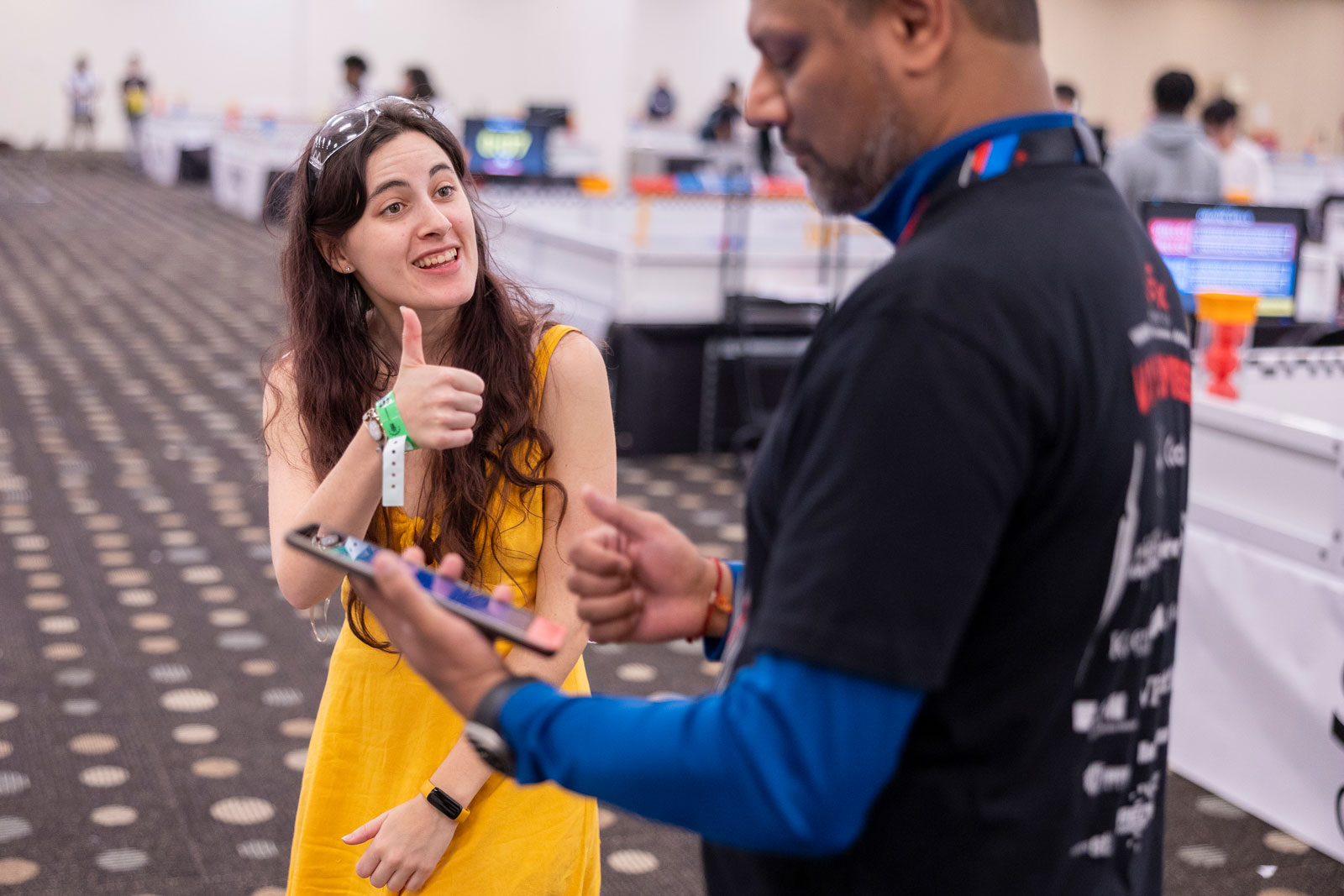 Participant gives a thumbs up to a volunteer at the VEX Robotics World Championship.