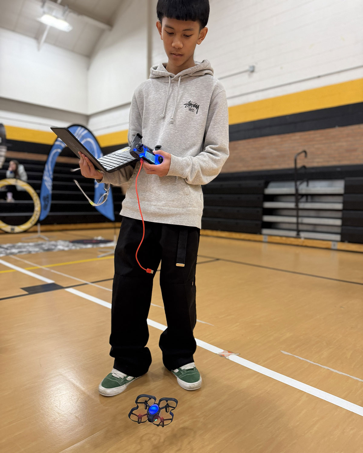 Student works with drone